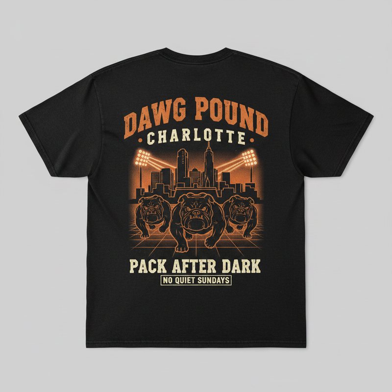 Queen City After Dark tee — three bulldogs under stadium lights and the Charlotte skyline